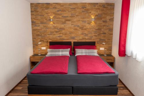 Haus Alpin Apartmentsにあるベッド