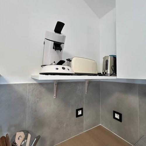 Η κουζίνα ή μικρή κουζίνα στο Les vagues de 3 bassins Superbe appartement Spa