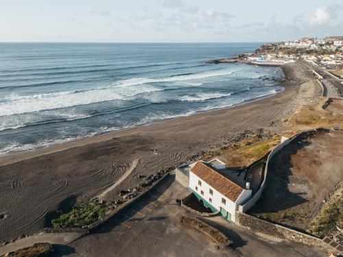 an aerial view of a beach with the ocean at Moinho da Areia - Boutique Hotel in Azores in Ribeira Grande