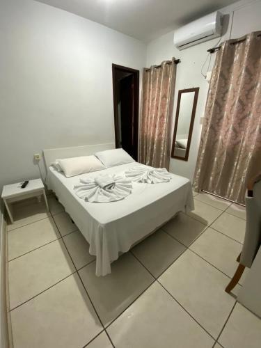 a bedroom with a bed in a room at Hotel Ferrari in Rio do Sul