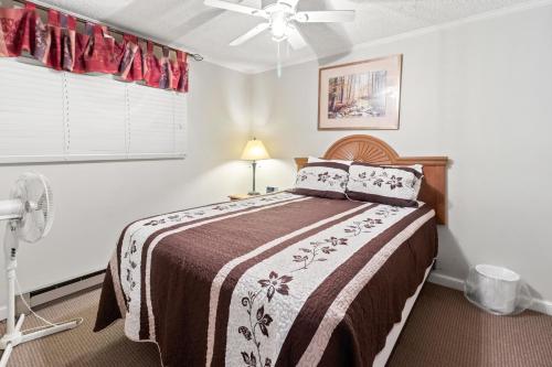a bedroom with a bed and a ceiling fan at ML229 Mountain Escape Great for Relaxing Near Village in Snowshoe