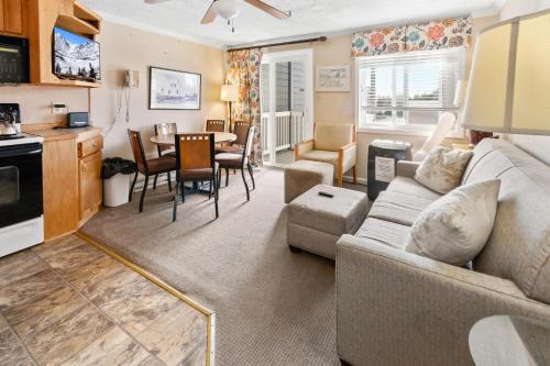 a living room with a couch and a table at ML229 Mountain Escape Great for Relaxing Near Village in Snowshoe