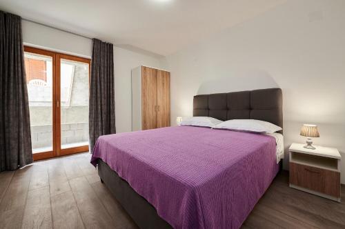 Posteľ alebo postele v izbe v ubytovaní Apartments Antonia