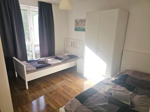 Llit o llits en una habitació de City Apartment Köln