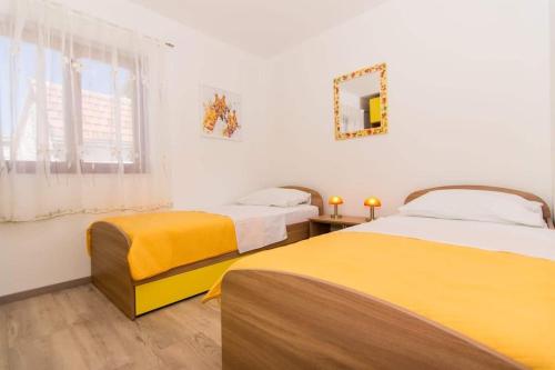 Posteľ alebo postele v izbe v ubytovaní Apartment Tom
