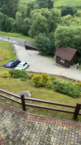 a car parked in a parking lot next to a building at Georgiy in Oryavchyk