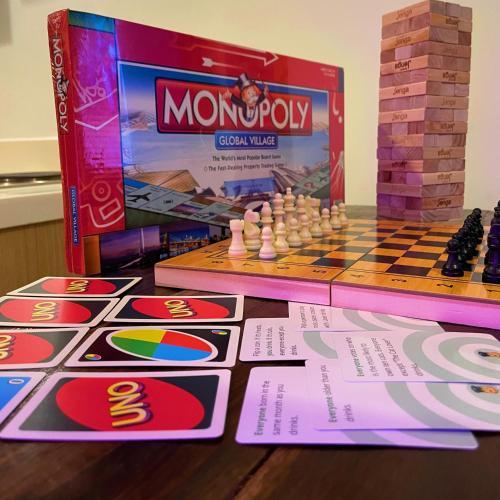a monopoly board game and a box of chess at 1 Bedroom Penthouse 3BEDS Sunset & City lights with big balcony FREE ACCESS to all amenities in Manila