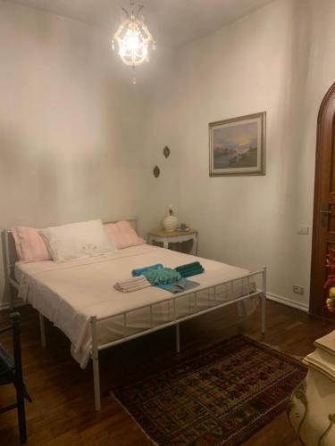 a bedroom with a bed with a table in it at Allulivus in Montenero