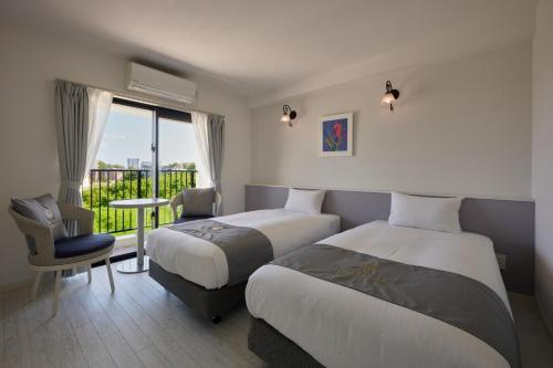 Cama o camas de una habitación en Hotel & Villa Seahorse MIYAKOJIMA