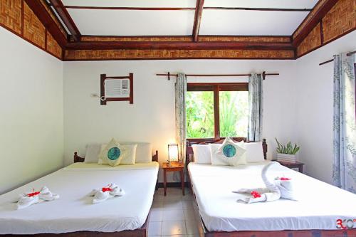 Postel nebo postele na pokoji v ubytování Point 303 Resort