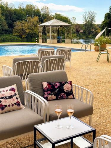 a group of chairs with wine glasses on a table at LA RESERVE ALBI Hôtel Restaurant in Albi