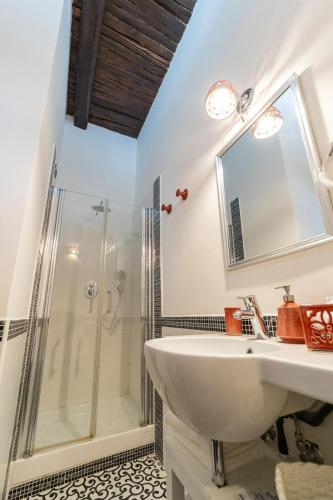 a bathroom with a sink and a shower at B & B Boutique Epoca in Salerno