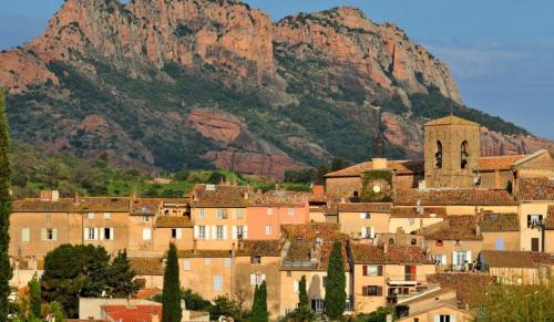 a group of buildings in front of a mountain at Villa Maolo in Roquebrune-sur-Argens