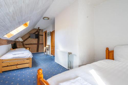 Postel nebo postele na pokoji v ubytování Gîte du Relais de l'Ourthe