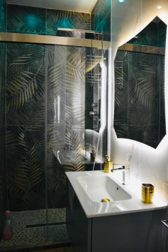a bathroom with a sink and a mirror at B&B Romeo2 in Bari