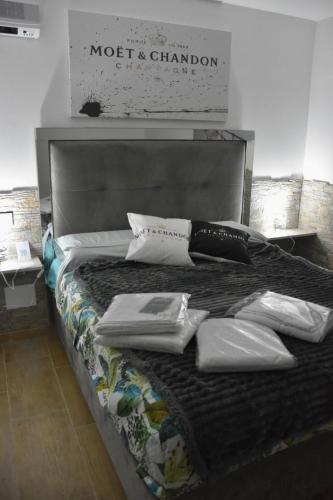 a large bed with pillows on it in a room at B&B Romeo2 in Bari