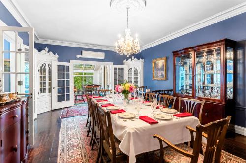 a dining room with a long table and chairs at Benn Conger Inn in Groton