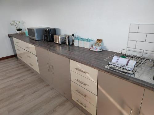 a kitchen with a counter top in a room at Hermanus Reefs in Hermanus