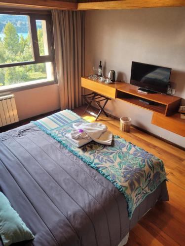 Кровать или кровати в номере Boutique Hotel & Spa Bosque del Nahuel