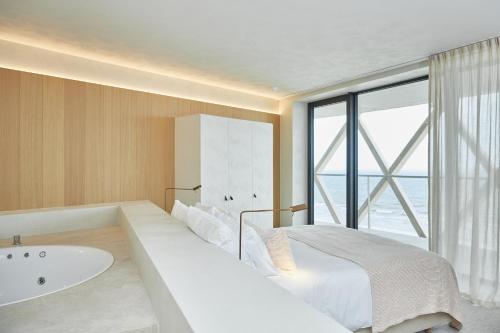 Postel nebo postele na pokoji v ubytování C-Hotels Silt