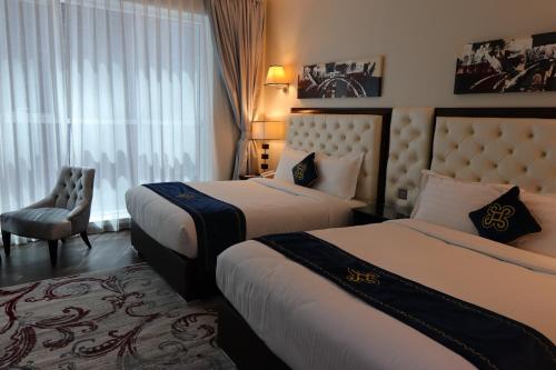 Un ou plusieurs lits dans un hébergement de l'établissement Seven Seas Hotel