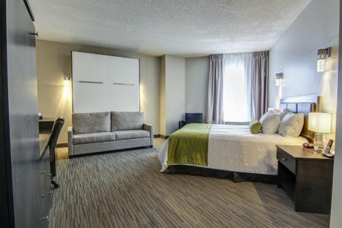 Кровать или кровати в номере Hôtel du Jardin