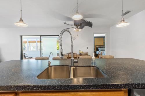 a kitchen with a sink and a counter top at Relaxing Coastal Comfort - Heated Pool in Clearwater