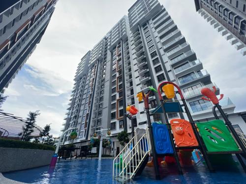 a playground in the water in front of a building at K AVENUE - 2 Bedroom with Privacy Balcony by Akinabalu Family Homestay in Donggongon