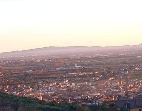 a view of a city from a hill with buildings at B&B Il Rifugio in Camigliano
