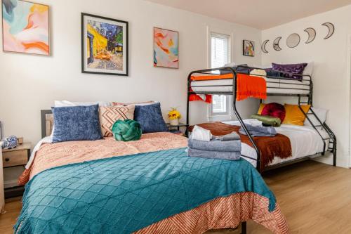 a bedroom with two bunk beds and a bed at Stylish & Family Friendly 2BR at Downtown Washington DC in Washington, D.C.