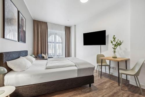 Postel nebo postele na pokoji v ubytování Limehome Leipzig Am Brühl