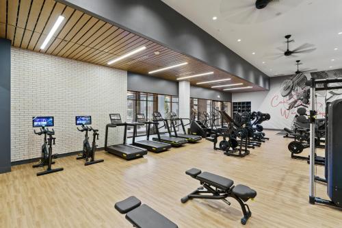 a gym with several treadmills and elliptical machines at WhyHotel by Placemakr, Columbia in Columbia