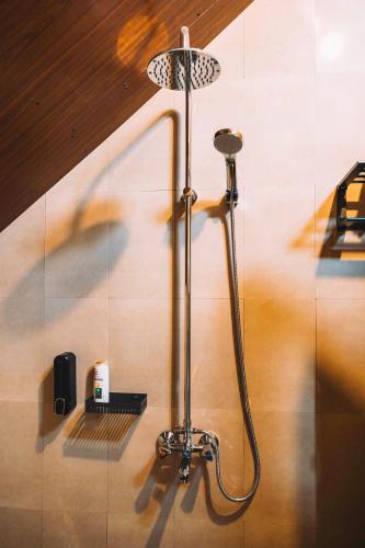 a shower in the corner of a bathroom at Samora River Lodge in Kioga