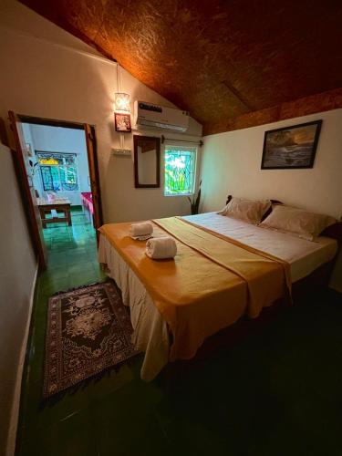 a bedroom with a large bed in a room at Bramha Home Stay in Canacona