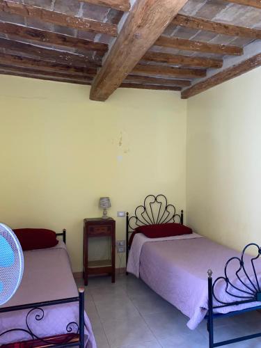 Ένα ή περισσότερα κρεβάτια σε δωμάτιο στο Casa Betta & Colombo