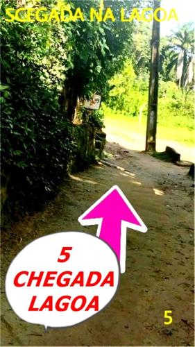 an image of a sign with an arrow at Pousada Lagoa Flat in Morro de São Paulo