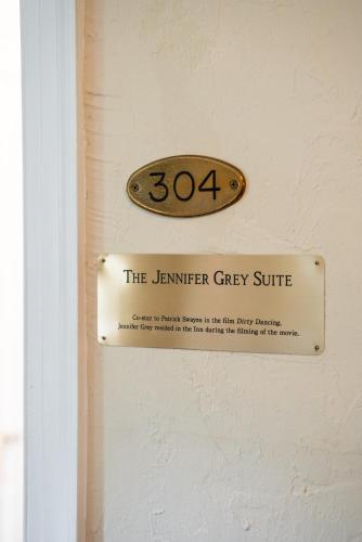 a sign on a door that reads the learner grey suite at Lake Lure Inn and Spa in Lake Lure