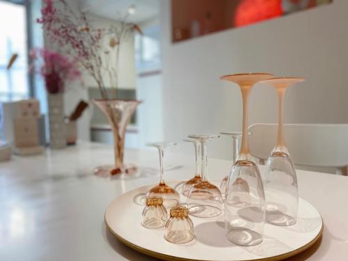 a group of wine glasses sitting on a table at "Rose" Atypique, clim, coeur du Quartier Haut in Sète