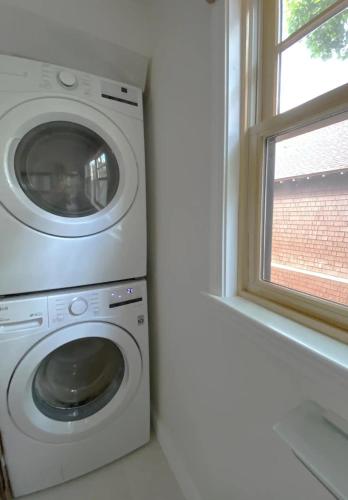 a washing machine in a room with a window at Harvard Square Private Room near Harvard University in Cambridge