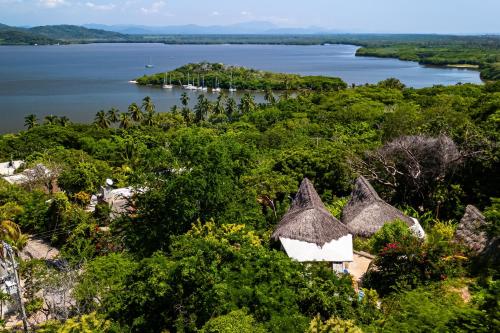 an aerial view of a resort with a lake at Villa Heliconia in Barra de Navidad