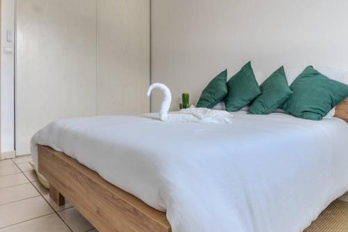 Ένα ή περισσότερα κρεβάτια σε δωμάτιο στο Cactus appartement T4