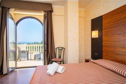 Ένα ή περισσότερα κρεβάτια σε δωμάτιο στο Kala Kretosa Hotel