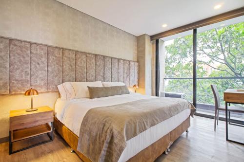 Katil atau katil-katil dalam bilik di 2 Bdr Suite W2 AC Poblado, Medellin