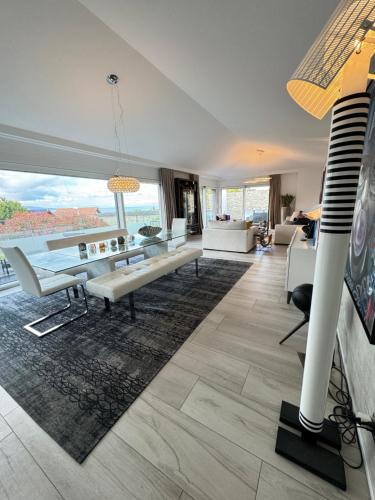 a living room with a view of the ocean at La Riviera in Corseaux