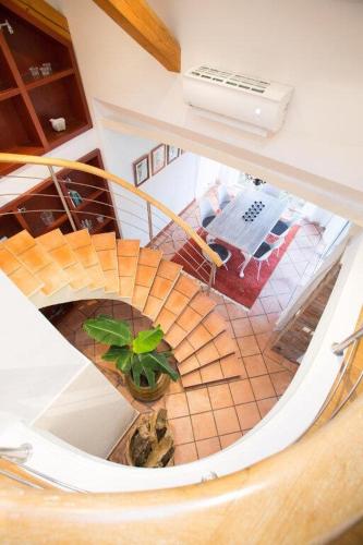an overhead view of a spiral staircase with a plant at Nice Home In Vessigebro With 2 Bedrooms And Wifi in Vessigebro