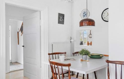 a white dining room with a table and chairs at Stunning Home In Sydals With Wifi in Bro