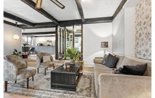 a living room with a couch and chairs and a table at Beautiful Home In Grenaa With Wifi in Grenå