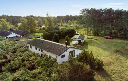an aerial view of a white house in a field at 3 Bedroom Stunning Home In Rødby in Rødby