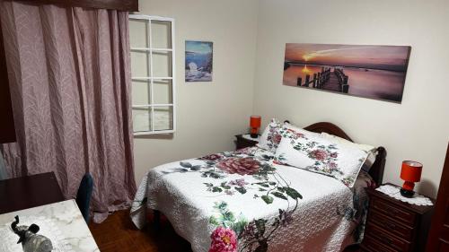 a small bedroom with a bed and a window at Terra Chã Cottage,FEEL Home, in São Vicente