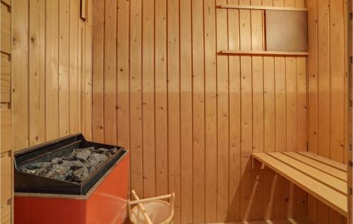 a inside of a sauna with a tub and a shelf at Awesome Home In Nordborg With Sauna in Nordborg